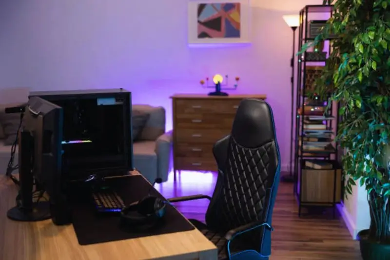 compact corner gaming setup in small bedroom