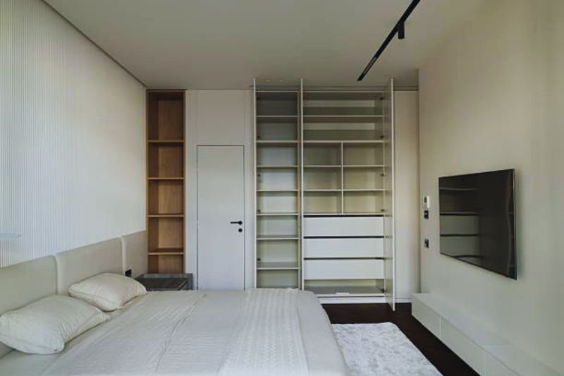 floor to ceiling wardrobe system in small bedroom