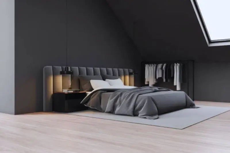 low profile black platform bed in small mens bedroom