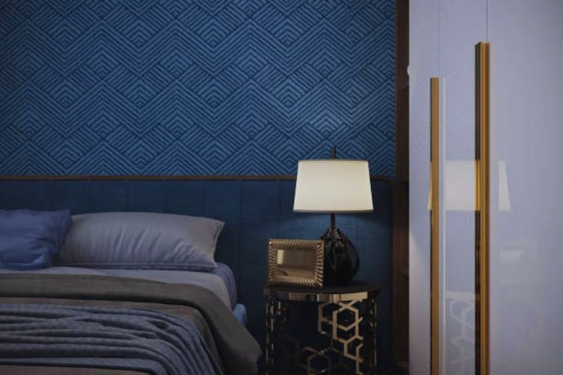 peel and stick accent wallpaper behind bed in small bedroom