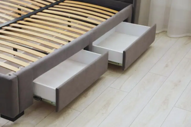 rolling under bed storage bins in small bedroom