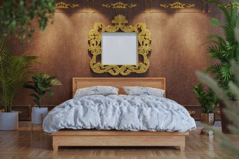 round mirror above headboard in small bedroom