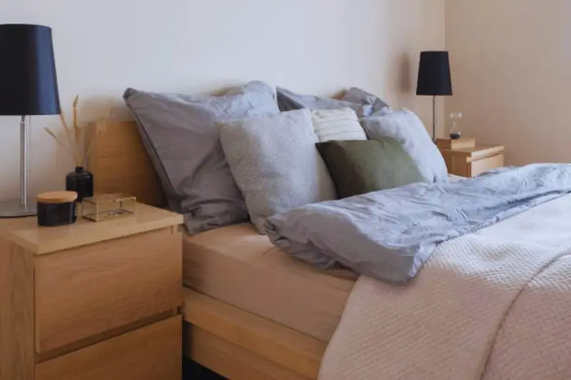 storage bed with pull out drawers in small mens bedroom