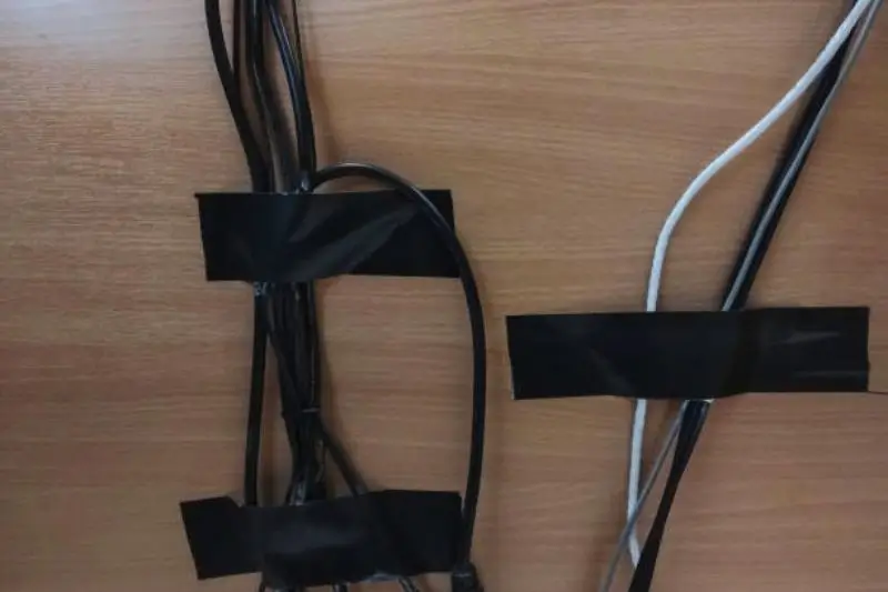 tidy cable management behind desk in small bedroom