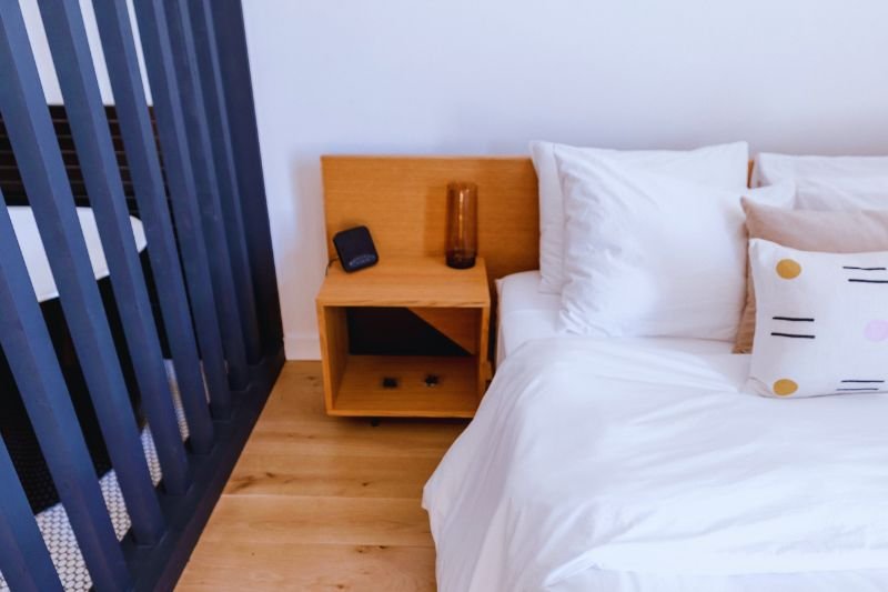 wall mounted folding nightstand in small bedroom