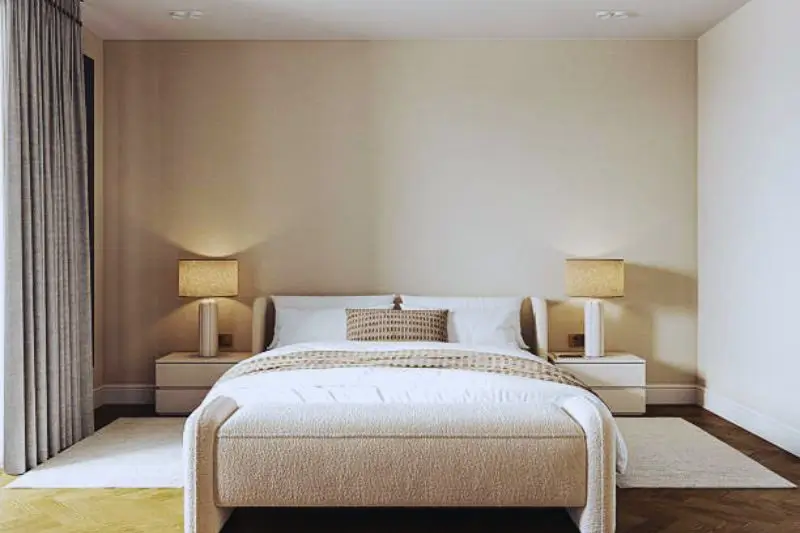 matching round nightstands with lamps in small couples bedroom