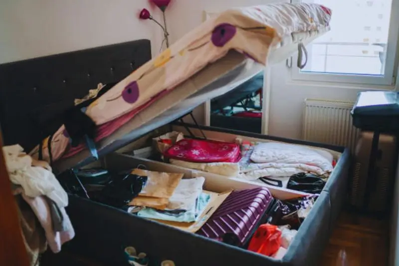 modular fabric storage cubes arranged under bed