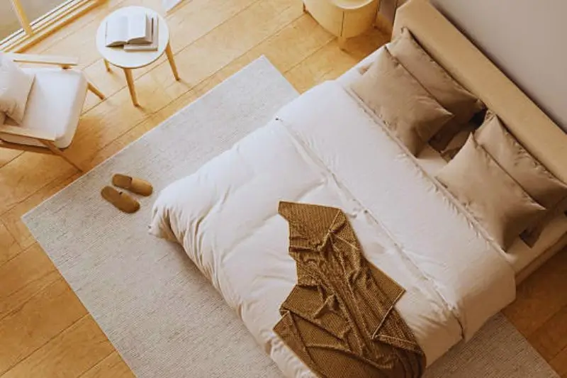 tonal beige and cream palette in small couples bedroom