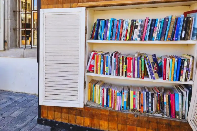 wooden crates on wheels with books under bed