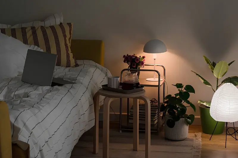 compact accent chair with floor lamp in small bedroom corner