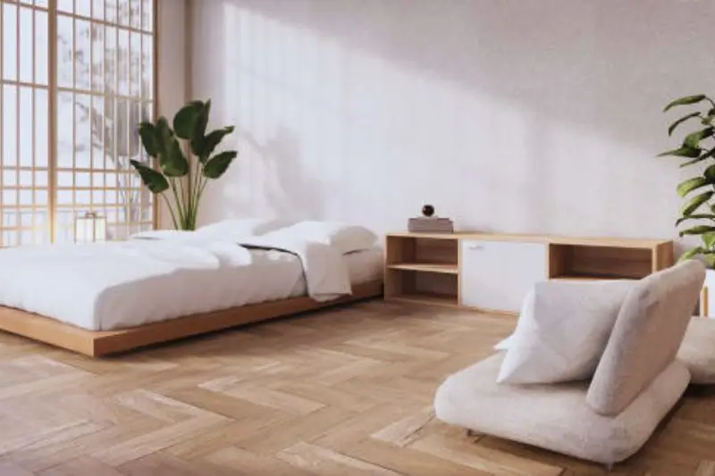 platform bed with storage drawers in small couples bedroom